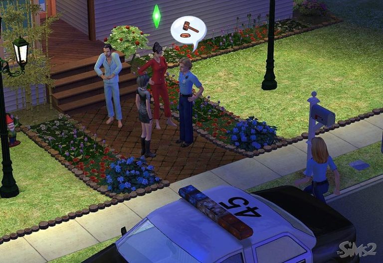 Screenshot of The Sims 2 showing a female Sim in a red outfit talking to a police officer on a brick walkway outside a house. She has a green Plumbob above her head and a thought bubble containing a judge's gavel. A male Sim in blue pajamas stands next to her, while a police car is parked on the street in the foreground.