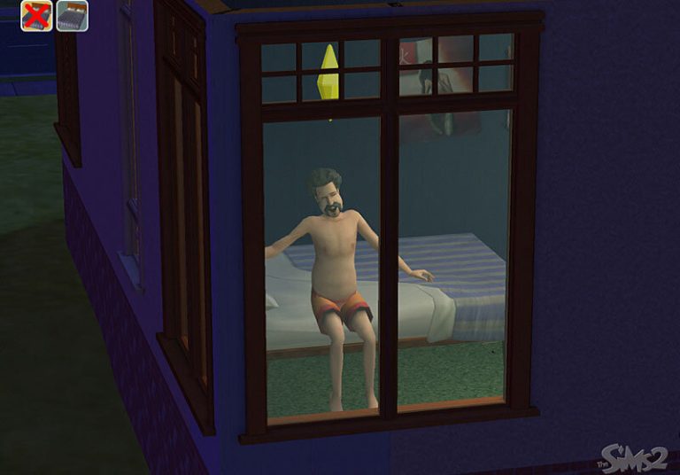 Screenshot of The Sims 2 showing a view from outside looking through a large window into a bedroom. A Sim wearing orange and yellow shorts is sitting on a bed with a blue striped blanket. A yellow Plumbob is floating above their head.
